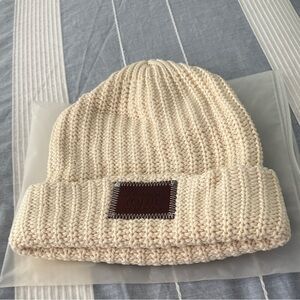 Cozy Cream Knit Beanie with Brown Patch